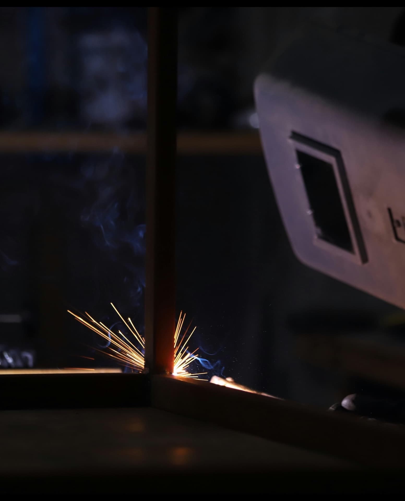 NDT technician inspecting a welded joint with portable ultrasonic equipment